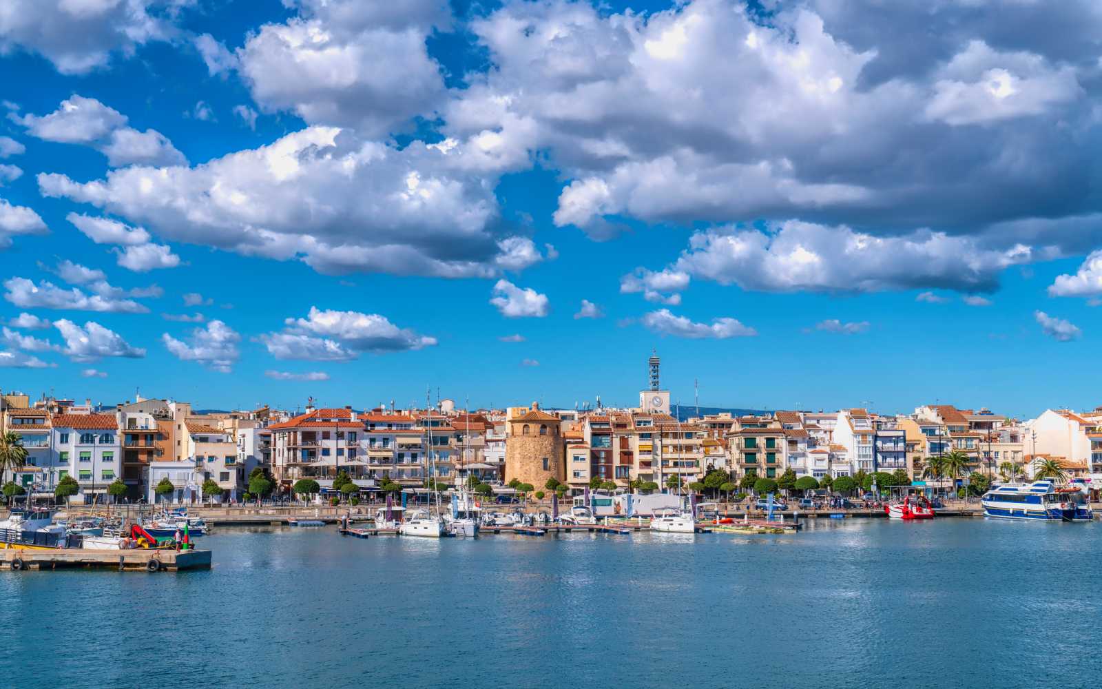 Cambrils seafront Spain boats and buildings in Tarragona Province Catalonia with blue Mediterranean sea and sky