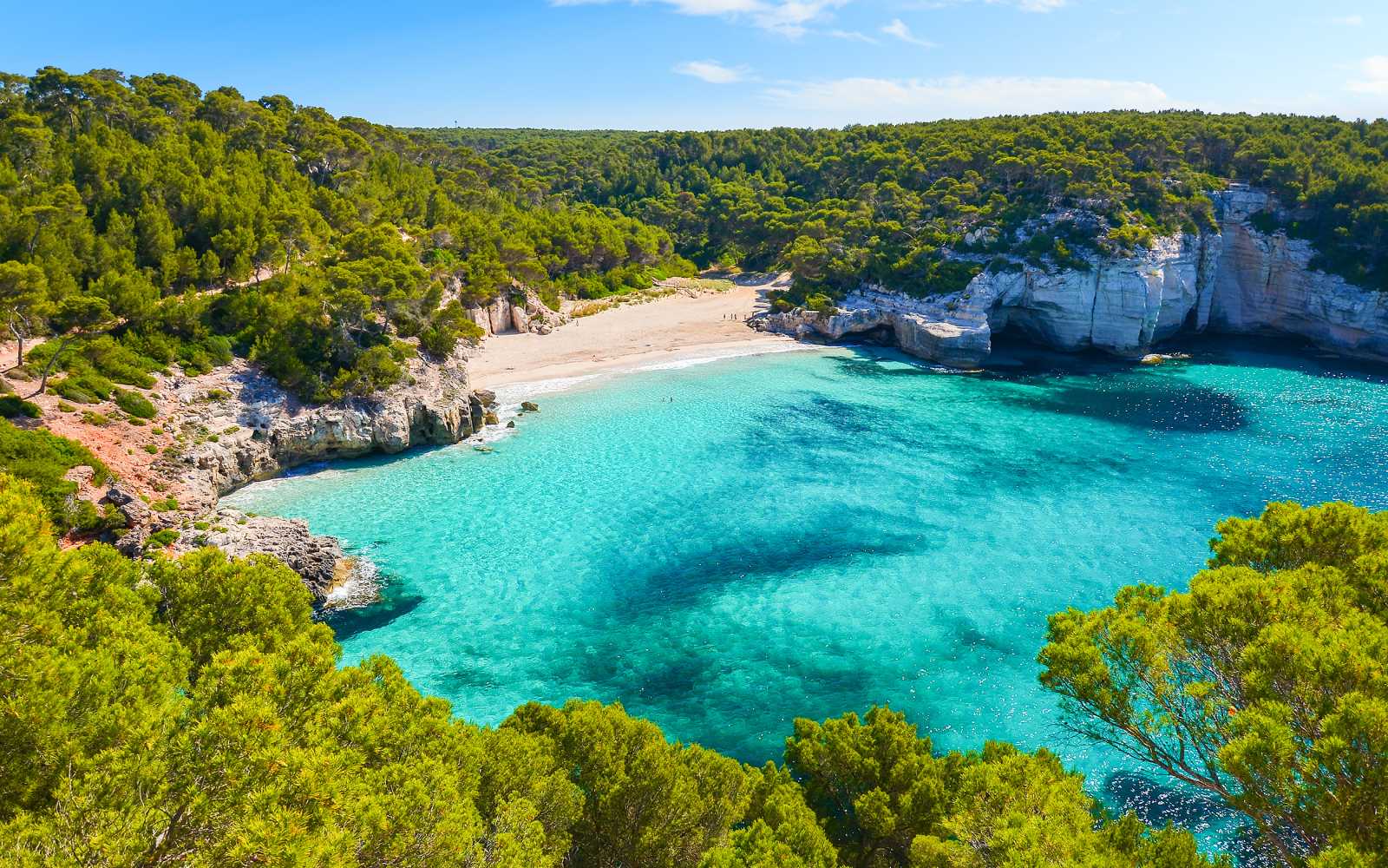 View of Mitjaneta beach with beautiful turquoise sea water, Menorca island, Spain